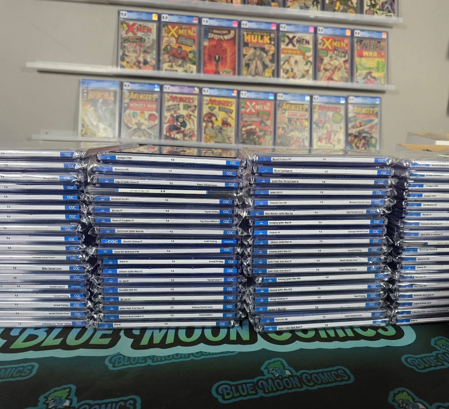 Stacks of CGC comics at Blue Moon Comics
