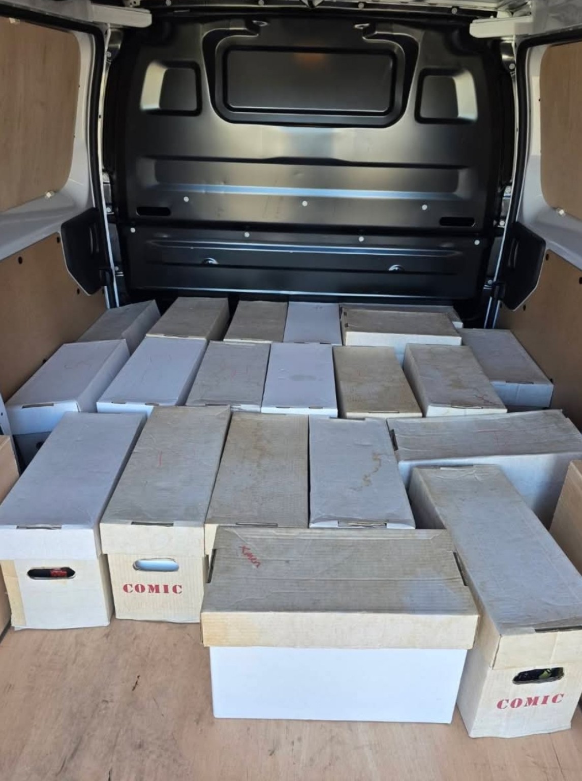 Van loaded with comic collection boxes